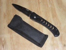 Vintage Old Stock Black Automatic Knife Serrated